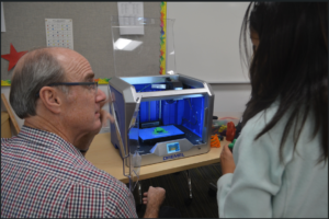 March 2022 - Bob showing 3D printing to a middle school student in Santa Paula.